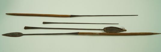 Two Masai warrior spears, one with a wooden handle together with two fishing spears,