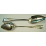 A pair of Georgian silver table spoons, makers mark T.W.