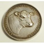 An Angus Cattle Association Jingo of Basildon 1930 silver medal,