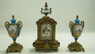A 19th century French clock garniture, the gilt metal case inset with Sevres style plaques,
