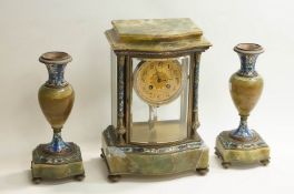 A 20th Century French marble clock garniture, inlaid with blue enamels.