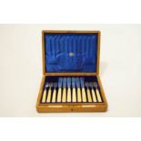 A set of twelve silver and ivory fish knives and forks, by Goldsmiths and Silversmiths Co Ltd,