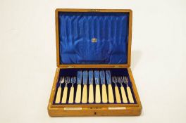 A set of twelve silver and ivory fish knives and forks, by Goldsmiths and Silversmiths Co Ltd,