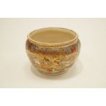 An early 20th Century Oriental Jardiniere, decorated all over with various figures,