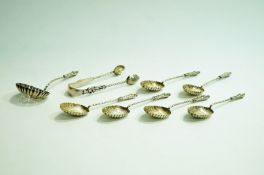 A set of six Edwardian silver tea spoons with sugar tongs and sifting spoons; Birmingham 1902,