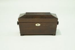 A Victorian rosewood veneer Tea caddy, with moulded glass liner on four bun feet,