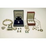 A collection of silver and silver coloured jewellery,