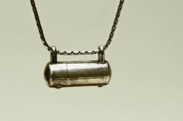 A silver necklace with pill holder,