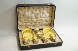 A cased set of Aynsley cups and saucers, each with a silver holder, cased.