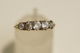 A late Victorian five stone diamond ring, stamped '18ct',