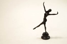 An Art deco style bronze of a dancing lady, on a marble base, signed M Mirval, 42cm high.