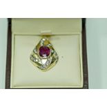 A ruby and diamond pendant, stamped '585' and oriental character marks,