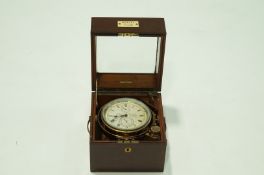 A Marine chronometer by Thomas Mercer, serial number 11393, in a fitted mahogany case.