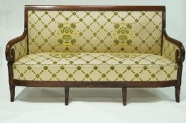 An early 19th Century French Empire sofa with mahogany show frame and splayed legs. 175cm wide.