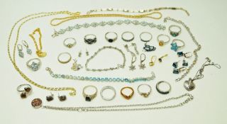 A collection of silver and silver coloured set jewellery, including earrings, bracelets,