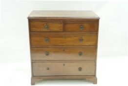 A 19th Century mahogany chest of two short and three long drawers with ring handles on bracket feet,