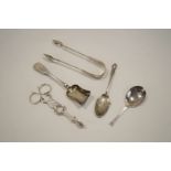 A George III silver shell bowl sugar nips; an Exeter fiddle pattern sugar spoon;