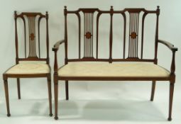 An Edwardian mahogany and boxwood strung salon suite, with turned tapering legs,