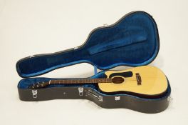 A George Washburn guitar and case.