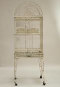 A large modern, white painted bird cage, 172cm high x 60cm wide.