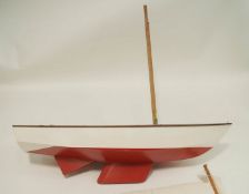 A large pond yacht, white painted with a red keel. 40.5cm long.