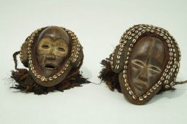 A pair of Chokwe ceremonial masks with Cownie masks & feathers,