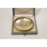 A silver dish, Austrian control marks and stamped '800', set with a coin to the centre,