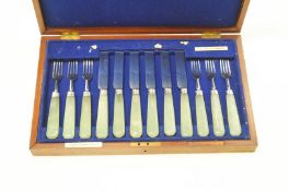 A set of six silver fruit knives and forks, by Goldsmiths & Silversmiths Co Ltd, London 1904,