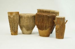 Five various tribal drums, each with hide skins. 46.5cm high x 42cms diameter.