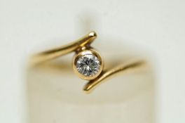 A single stone cubic zirconia ring, stamped '9K', finger size F, 1.
