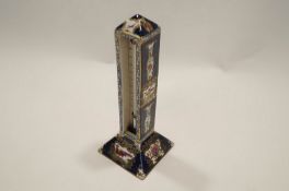 A Negretti and Zambra thermometer mounted in Booth ceramic case decorated with exotic birds in