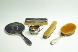 A silver and tortoiseshell pique work four piece dressing table set,