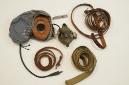 A RAF World War II helmet, type G, along with three leather belts and one other belt,