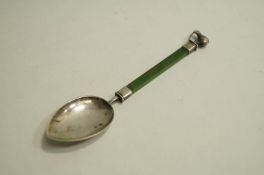 A spoon, probably from New Zealand, with a nephrite stem and Kiwi finial, 11.