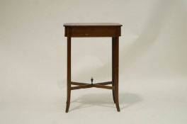 An Edwardian mahogany work table with shell inlaid top, a fitted interior and makers label,