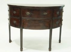 A George III style mahogany demi lune sideboard with two drawers flanked by a cupboard door and a
