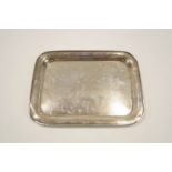 A silver dressing table tray, Birmingham 1922, of plain rectangular form, 26.5 cm long, 303 g (9.