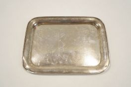 A silver dressing table tray, Birmingham 1922, of plain rectangular form, 26.5 cm long, 303 g (9.