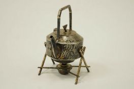 An Aesthetic Movement silver plated teapot on stand, with burner,