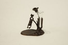 A 20th Century bronze flower vase with a frog diving into a pond with a single glass vase,