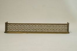 A pierced brass fender 118cm long.