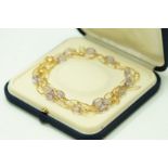 An amethyst beaded necklace and bracelet set, stamped '750',