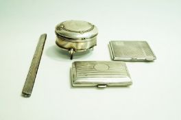 A silver powder compact; a silver circular trinket box; a silver cigarette case;