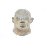 An African terracotta head of a Tribe's person, with eyes closed, 20.