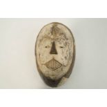 A carved Songue face mask,