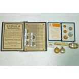 Three metal sovereign cases; a pair of silver ear studs,