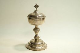 A French Ciborium and cover, with control marks, flat chased with fruiting vine and other flora,