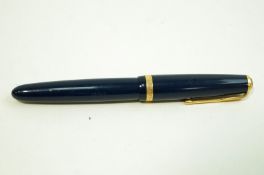 A Parker Duofold pen with 14 carat nib on a navy coloured case.
