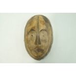 A carved Songue face mask,