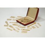 A collection of mother of pearl gaming counters; a simulated pearl necklace;